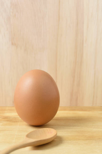 istock Fresh egg on a Brown wooden background 862633404