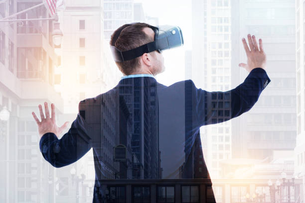 istock Back view of businessman wearing VR headset and spreading hands 862633616