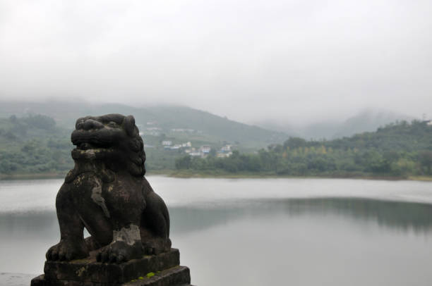 istock Lion statue beside the lake 862633982