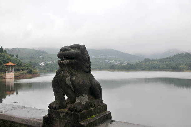 istock Lion statue beside the lake 862633992