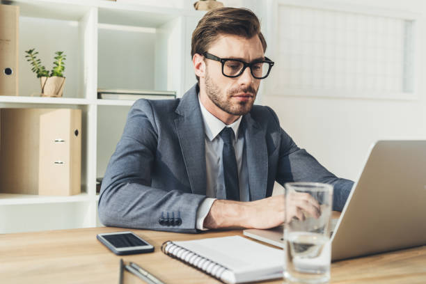 istock businessman in office working on laptop 862637234