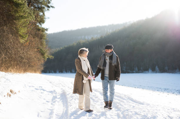 istock Beautiful senior couple on a walk on sunny winter day 862638540