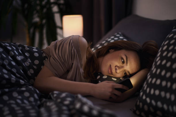 istock Beautiful Caucasian girl using smart phone in bed 862641296