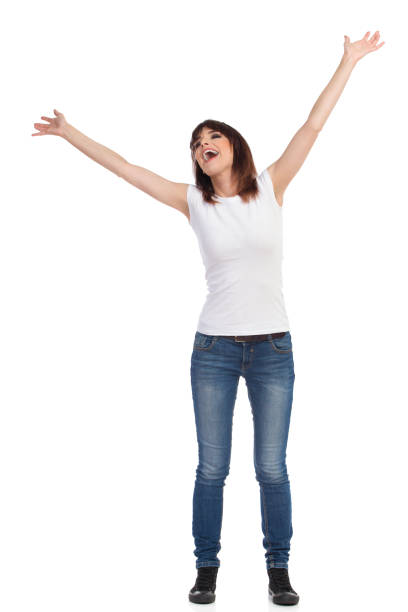istock Happy Young Woman Is Standing With Arms Outstretched And Shouting 862641380