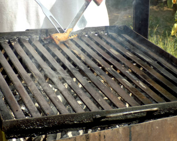 istock Coating barbecue grill with fatty bacon and preparing for grilling food 862641596
