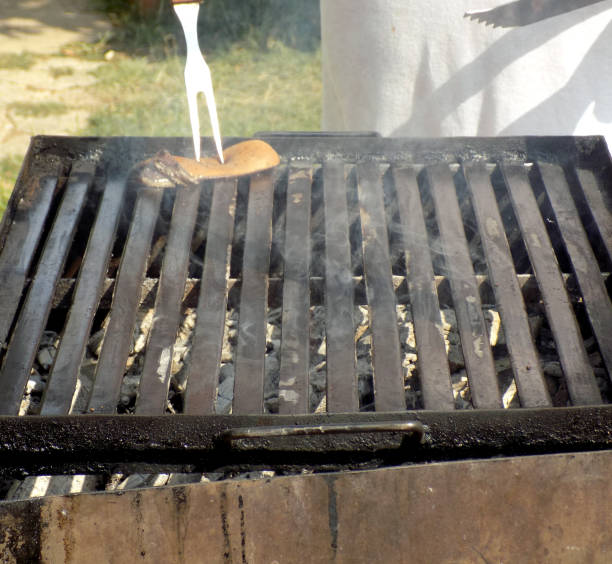 istock Coating barbecue grill with fatty bacon and preparing for grilling food 862641614