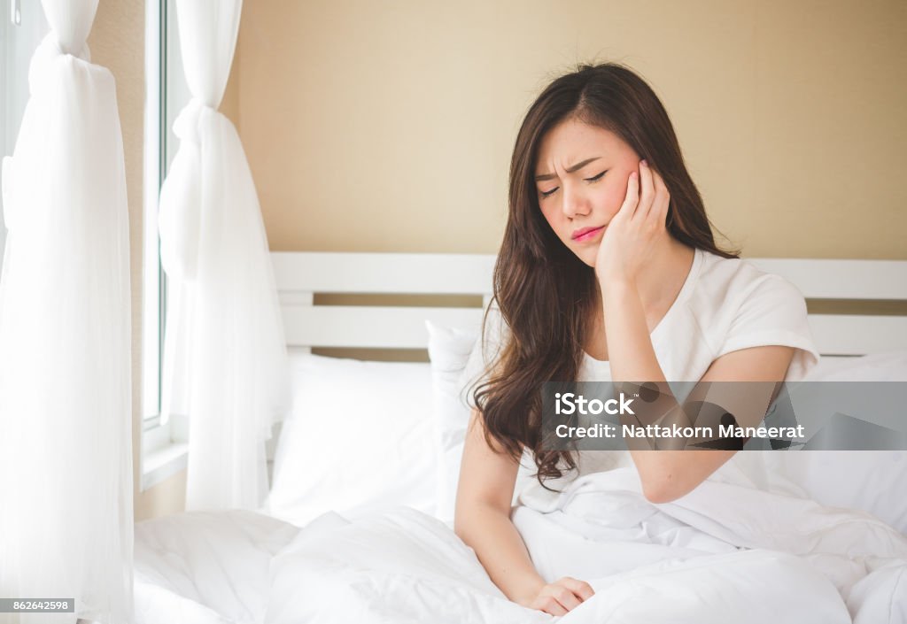 Asian woman toothache, pain, hurt and injured, tooth, teeth and dentistry woman concept Pain Stock Photo