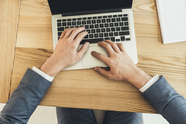 istock male hands typing on laptop 862645828