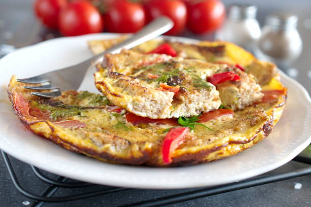 istock Omelet with eggs, tomato and dill on rye bread 862646266