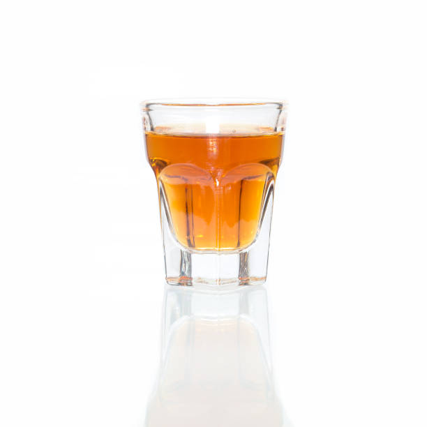 Cocktail Glass with brandy or whiskey - Small Shot. Isolated on white background