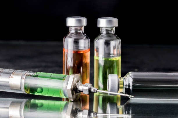 istock Several vials and syringe in laboratory, conceptual image 862649658