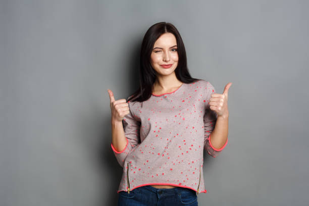istock Young beautiful woman with thumb up portrait 862650946