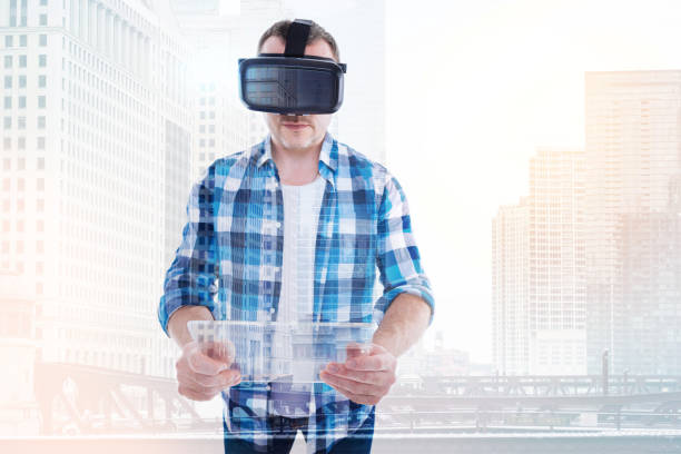 istock Pleasant man in VR headset having transparent tablet 862653096