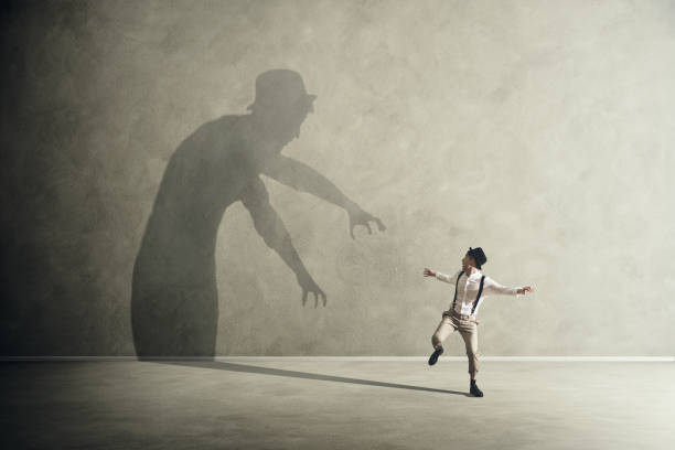 Man Shadow Scared 7,600+ Scary Shadow Wall Stock Photos, Pictures & Royalty-Free Images ...