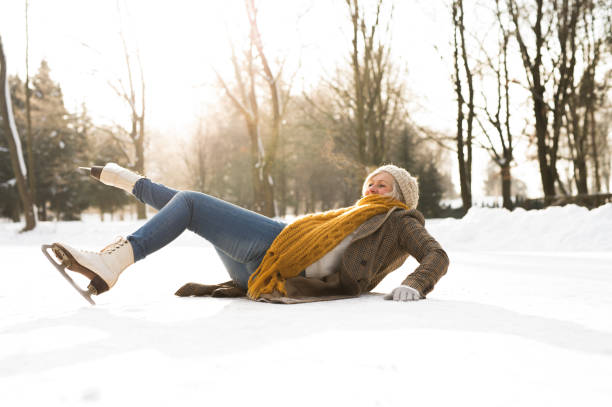 Senior woman on the ice after a fall.