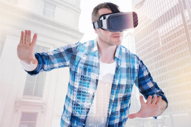 istock Handsome man stopping someone in VR game 862654170
