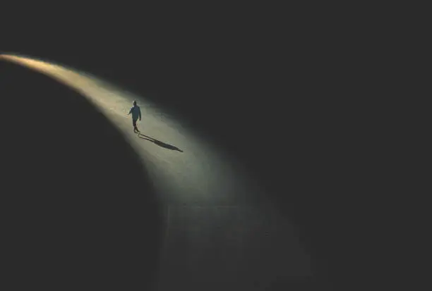 man walking in the night