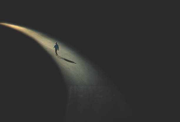 man walking in the night - conceptual vision imagens e fotografias de stock