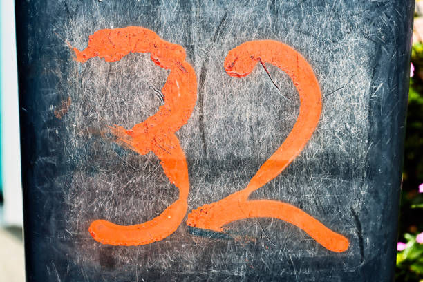 istock The number '32' sloppily hand painted on concrete 862657900