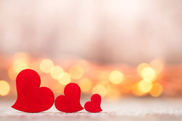istock Red hearts on the wooden background. 862657904