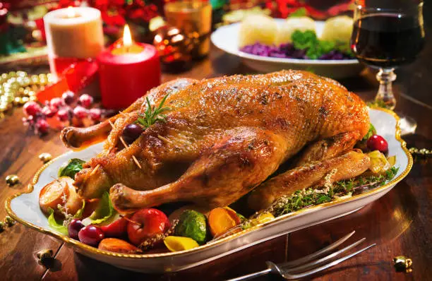 Roast Christmas duck with thyme and apples