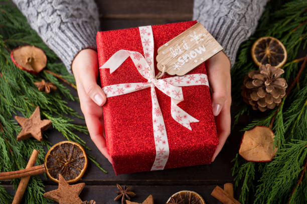 istock Woman hands making Christmas day gifts. 862663902