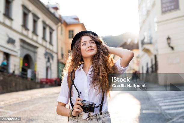 Young Tourist With Camera In The Old Town Stock Photo - Download Image Now - Tourist, Tourism, Teenager