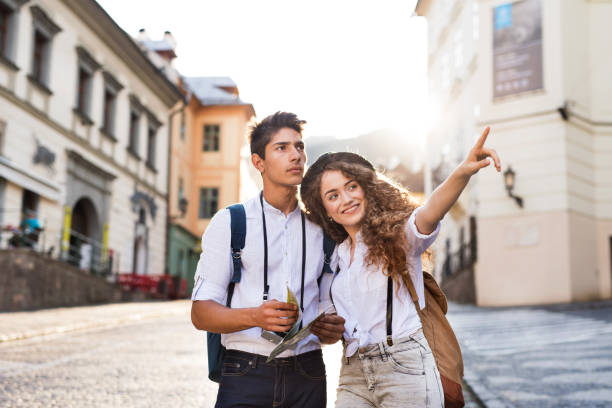 istock Two young tourists with map and camera in the old town 862664648