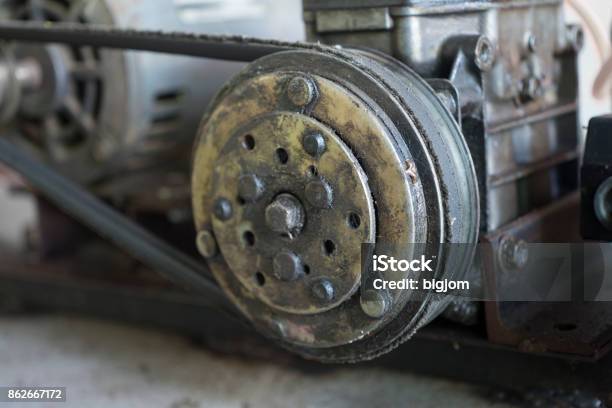 Close Up Pulley With Belt In Air Pump Stock Photo - Download Image Now - Belt, Business Finance and Industry, Circle