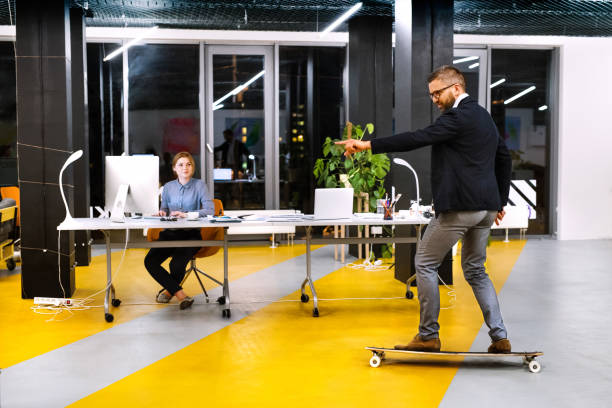Businesspeople in the office at night working late.