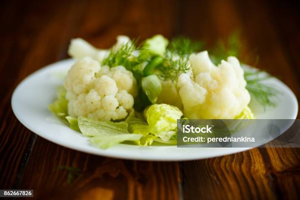 Cauliflower With Salad Leaves Stock Photo - Download Image Now - Appetizer, Backgrounds, Baked
