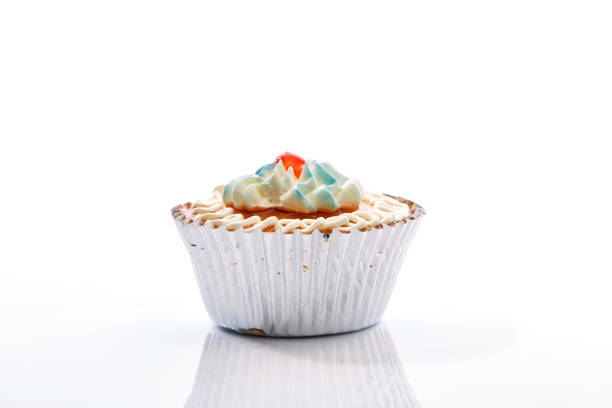 istock An isolated cupcake with sprinkles on a white background 862668126