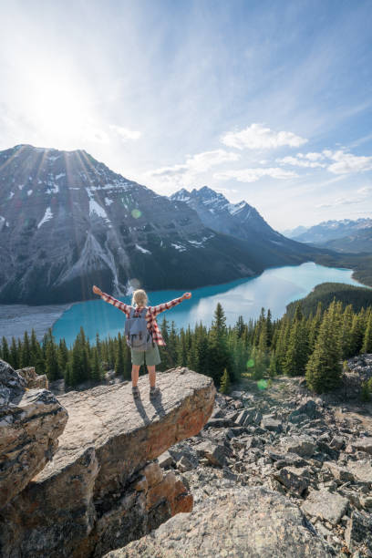 istock Hiker female on mountain top celebrating achievement 862668356