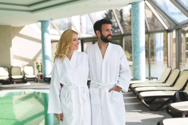 istock Beautiful cheerful couple relaxing in spa center 862668482