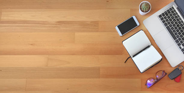 istock Top view of office desk on wooden background 862672016