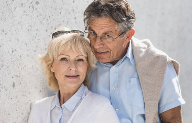 istock Portrait of a Senior Couple in Front a Wall 862675268