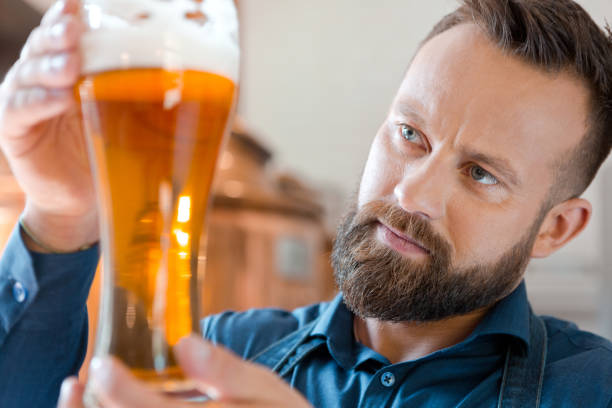 istock The master brewer holding beer glass in his micro brewery 862683972