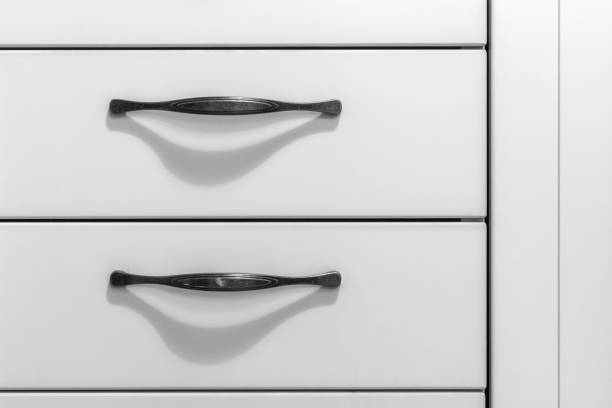 Image of a fragment of kitchen furniture, white color for use as a background.
