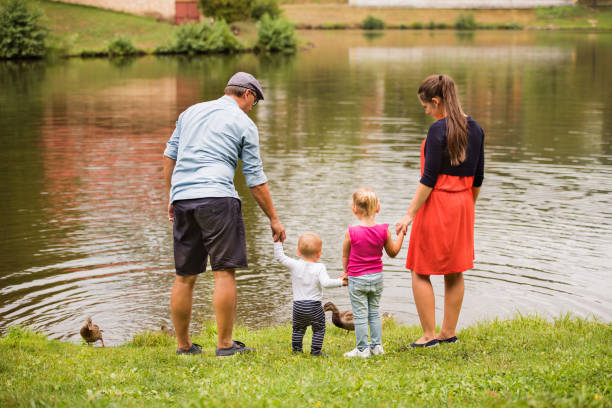 istock Happy family in nature in summer. 862688068