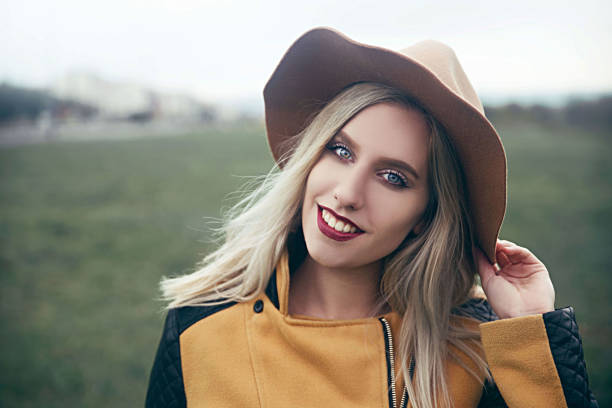 istock Blonde young woman wearing hat 862688102