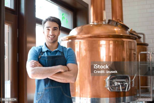 The Bartender Standing With Crossed Arms In Microbrewery Stock Photo - Download Image Now