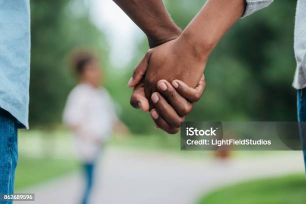 Couple Holding Hands Stock Photo - Download Image Now - Holding Hands, Couple - Relationship, African-American Ethnicity