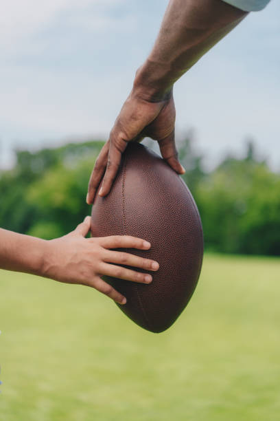 istock family holding rugby ball 862689748
