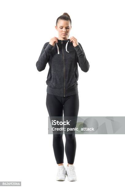 Woman Runner In Zip Up Hoodie Sweatshirt Get Ready For Running Looking Down Stock Photo - Download Image Now