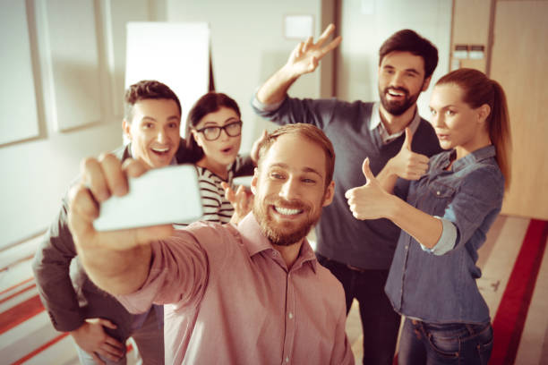 istock Cheerful bearded man holding a smartphone 862693282