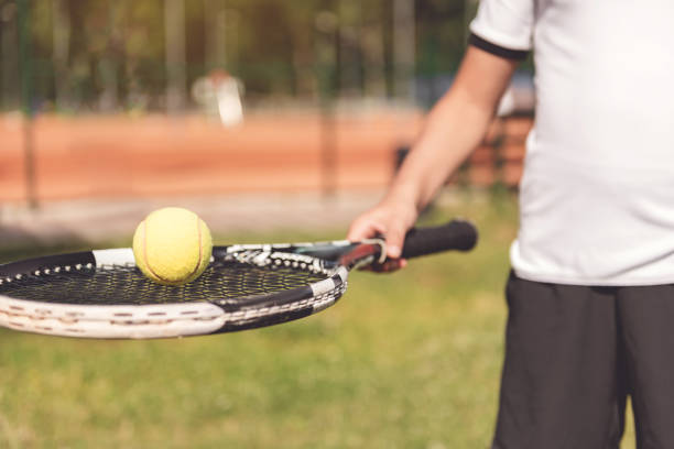 istock Boy keeping professional sport racquet 862698912