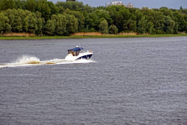 istock Little motor ship swims to down the river 862699368