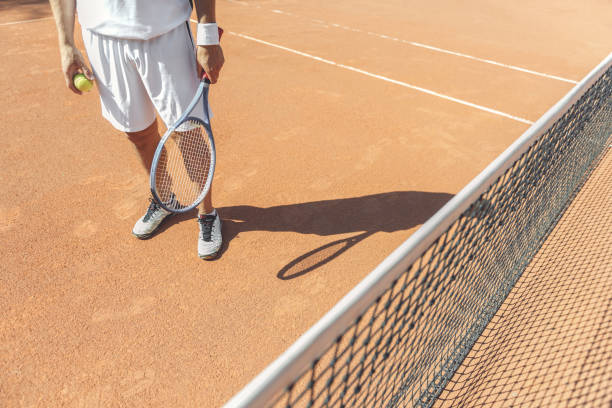 istock Sportive man standing at court 862699434