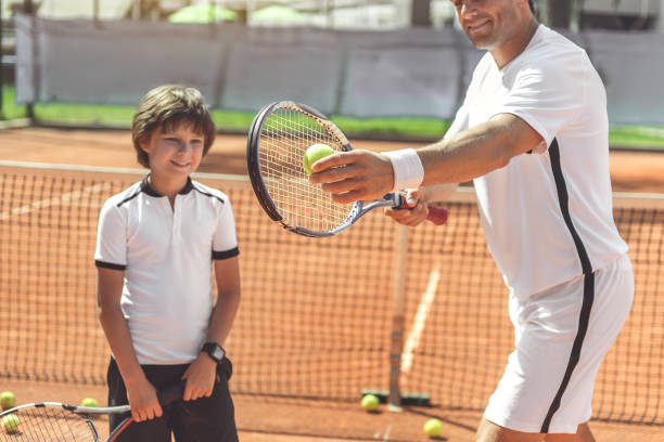 istock Happy smiling family playing tennis 862699982