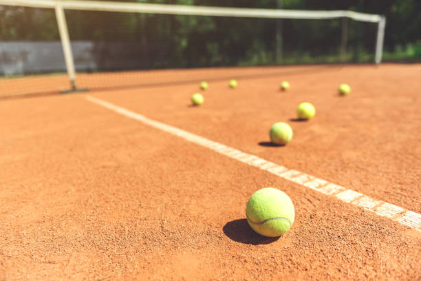 istock Various yellow small round balls on court 862700882